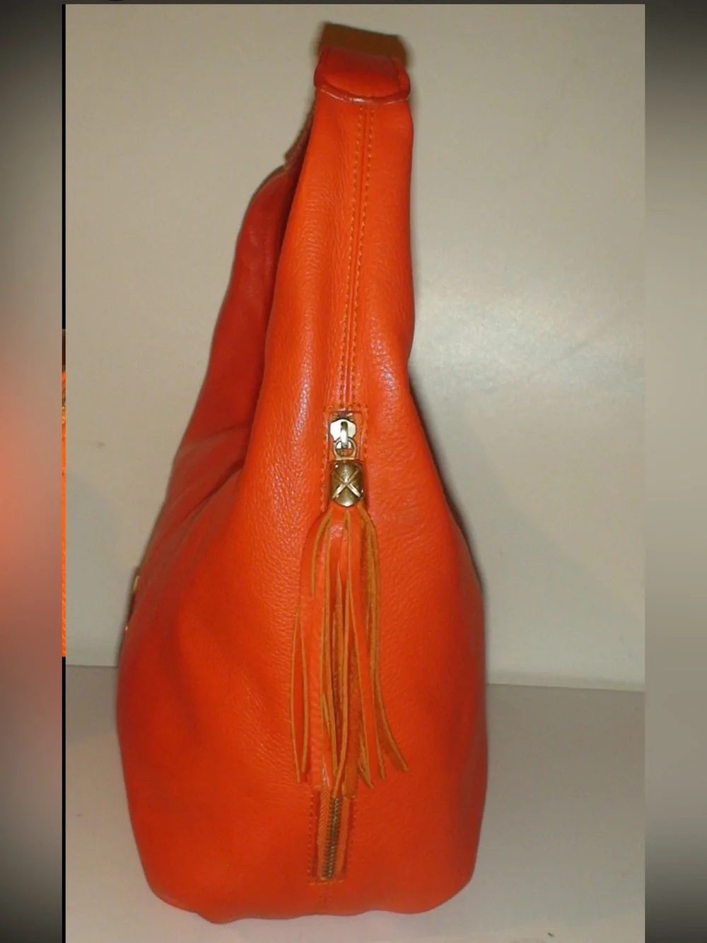 Mulberry Orange Leather Hobo Bag with Tassels and Gold Emblem